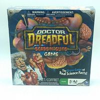 Front of the boxed Doctor Dreadful Scabs N' Cuts board game showing colorful human anatomy illustrations and branding.