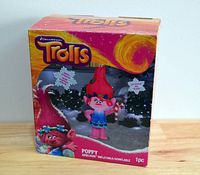 Front view of the packaged Gemmy 2017 DreamWorks Trolls Poppy Airblown Inflatable showing character image and branding.