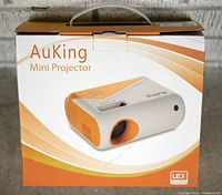 AuKing Mini Projector packaging box front showing product image and LED source label.