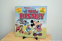 Front cover of the vinyl LP album featuring the title and colorful illustrations of Disney characters including Mickey Mouse and friends.