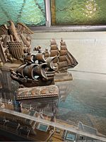 Brass book ends shaped like vintage sailing ships, showing front and side views with detailed sails and textured surfaces.