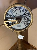 Front view showing white enamel command dial and brass housing