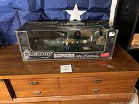 Full front view of boxed Motorworks Supermarine Spitfire Mk.I 1:18 scale model with pilot figure inside packaging.