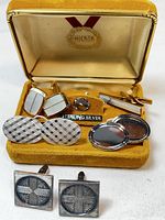 Set of 4 vintage men's silver tone and gold tone cuff links in a yellow lined box with Hickok mark.