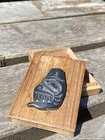 Box shown with lid removed, interior woven cedar lining visible, plaque on lid