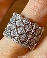Close-up image of the sterling silver ring showing the detailed diamond pave lattice pattern and milgrain edges.
