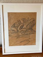 Front view of framed and matted pencil sketch on brown paper