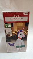 Photo of box for Holiday Time Magic Unicorn inflatable showing brand, model, and 3.5 ft height