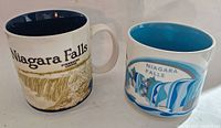 Both Starbucks Niagara Falls mugs side by side showing exterior designs and interiors.