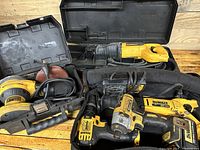 Overview of multiple DeWalt power tools including sander, reciprocating saw, drills, and chargers, showing condition and included items.