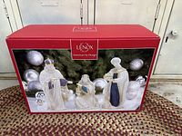 Photo of the original red Lenox box showing the nativity set with three kings figurines on the front.