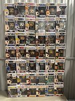Front view of stacked Funko Pop! boxes showing various characters and series.