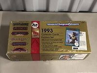 Gold box of 1993 Advanced Dungeons & Dragons Collector Cards Factory Set with legends Greyhawk, Al-Qadim, Dragonlance, Ravenloft, and Birthright