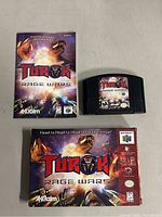 Nintendo 64 game cartridge labeled 'Turok Rage Wars' with original manual and box, all showing matching artwork.