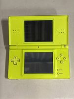 Top view with device open showing dual screens and control buttons