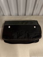 Closed black fabric game disc binder