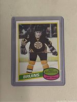 Front of the 1980 OPC Ray Bourque hockey card showing player image in Bruins jersey with name and team.