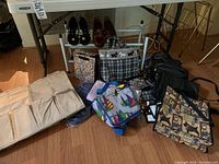 Overview of various bags, purses, shoe organizer, and shoe rack under the table