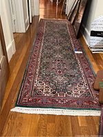 Full view of runner rug laid out in hallway