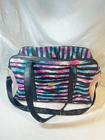 Full view of the colorful quilted Betsey Johnson weekender bag showing overall pattern and main handles.