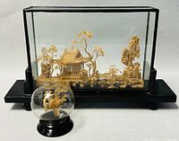 Large diorama cork carving in lacquer shadowbox with glass enclosure showing traditional pavilion scene with trees