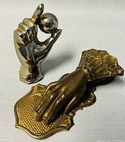 Front view showing both items placing the hand letter clip horizontally and the metal pen holder upright.