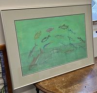 Image showing the framed pastel painting titled "Flying Fishes" with a variety of fish swimming on a blue-green background.