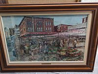 Framed art print showing a detailed market scene at Ottawa's Byward Market, signed by Trudy Doyle.
