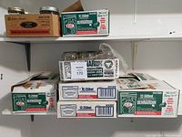 Stacked boxes of Bernardin and Golden Harvest brand canning jars in original packaging.