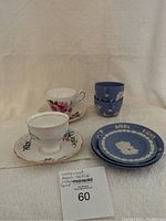 Overall view of four tea cups and four saucers including Wedgwood Jasperware and floral Regency English and Colclough tea sets.