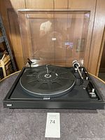 Front view of BIC turntable with clear dust cover in place. Shows overall condition and design.