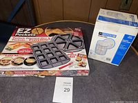 Lot with EZ Pockets 4-piece pan baking set and Portfolio handheld milk frother in original box.