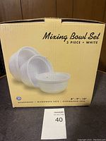 Box front showing 3-piece white mixing bowl set with sizes 8", 9", 10". Mentions ovenproof, microwave safe, dishwasher safe.