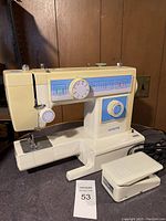 Front and side view of White brand sewing machine showing stitch selector, stitch pattern guide, and power cord.