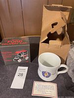 Photo showing Texaco Nostalgic Collector Series Ford Delivery Car box, Texaco ceramic mug with box, and certificate of authenticity.