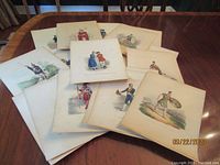 Multiple prints fanned out on wood table