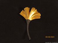 Front side of the Judith Jack ginkgo leaf brooch showing gold-tone leaf with marcasite decorated stem.