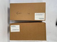 Two sealed cardboard boxes with Fisher Scientific EnviroWare labels containing EPA vials