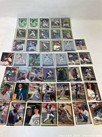 Front side of 44 assorted MLB baseball trading cards featuring player images and team logos.