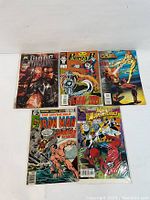 Photo showing the front covers of the 5 assorted vintage Marvel comic books featuring Blade, Punisher, X-Force, Iron Man, and Spider-Man.