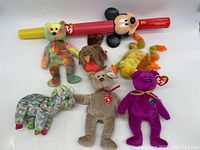 All six assorted animal plush toys including five bears with Ty tags and one Mickey Mouse bubble blower.