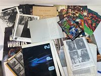 Assorted vintage movie and other photos, posters, and printed memorabilia laid out with varied sizes and colors.