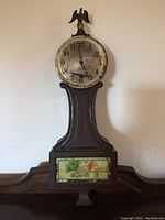 Sessions wall clock full view showing wood case and painted panel