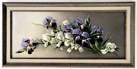 Full view of framed oil painting showing floral still life of purple and white irises, in vintage wooden frame.