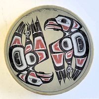 Top view of the hand drum painted with a pair of hawks in Haida style, showing the detailed artwork on the drumhead.