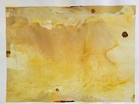 Abstract acrylic painting in shades of yellow and ochre with some brown spots. Paper shows texture and some stains, unframed, edges visible.
