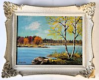Framed oil painting of lakeside autumn landscape by A. Siemon, showing full framed view with visible damage on bottom right corner of frame