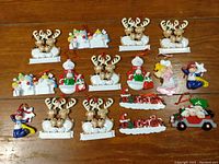 Photo showing the full lot of Christmas ornaments including reindeer, snowmen, angels, and festive vehicles.