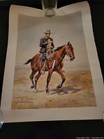 Full view of the poster print showing Charles Marion Russell on horseback in desert setting.