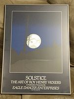 Framed print titled 'Solstice' by Roy Henry Vickers with presentation text and visible colors.